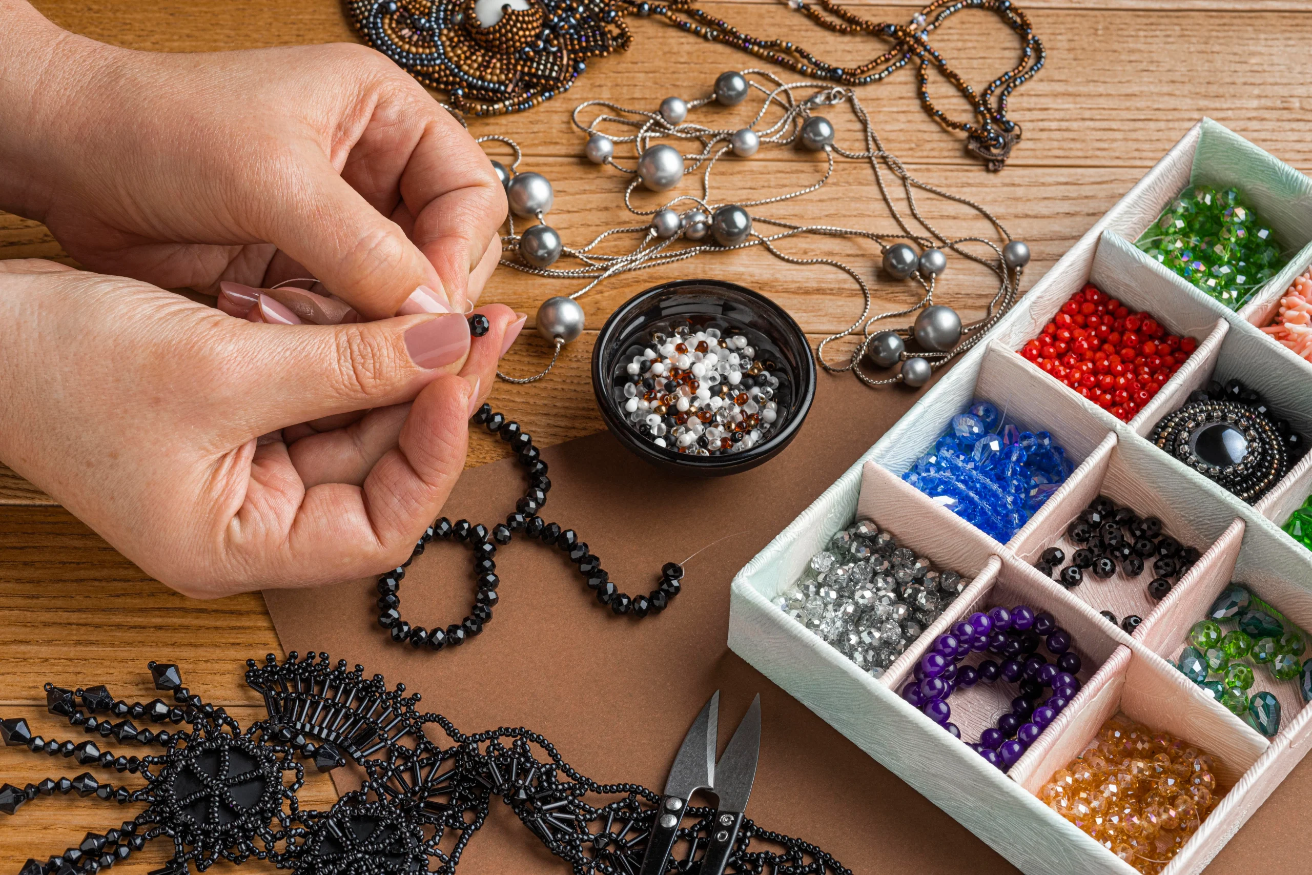 high-angle-person-doing-bead-work