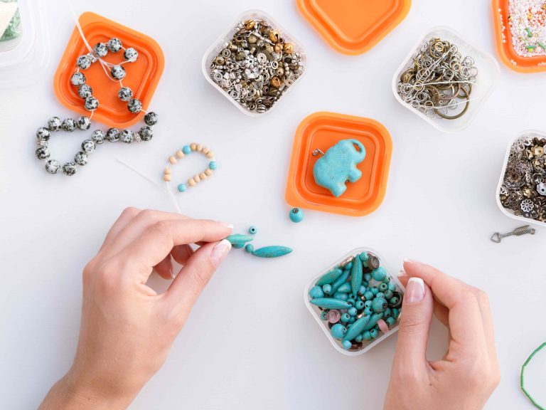 top-view-woman-making-colorful-accessories