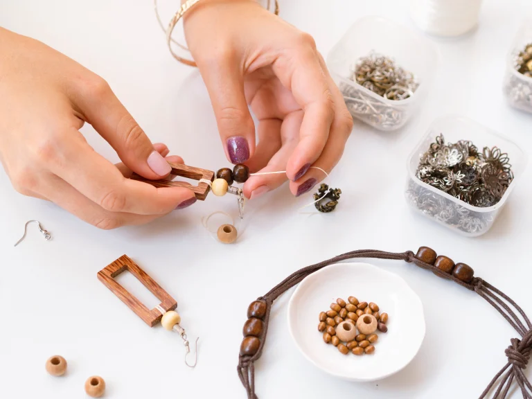 woman-making-accessories-with-wooden-beads