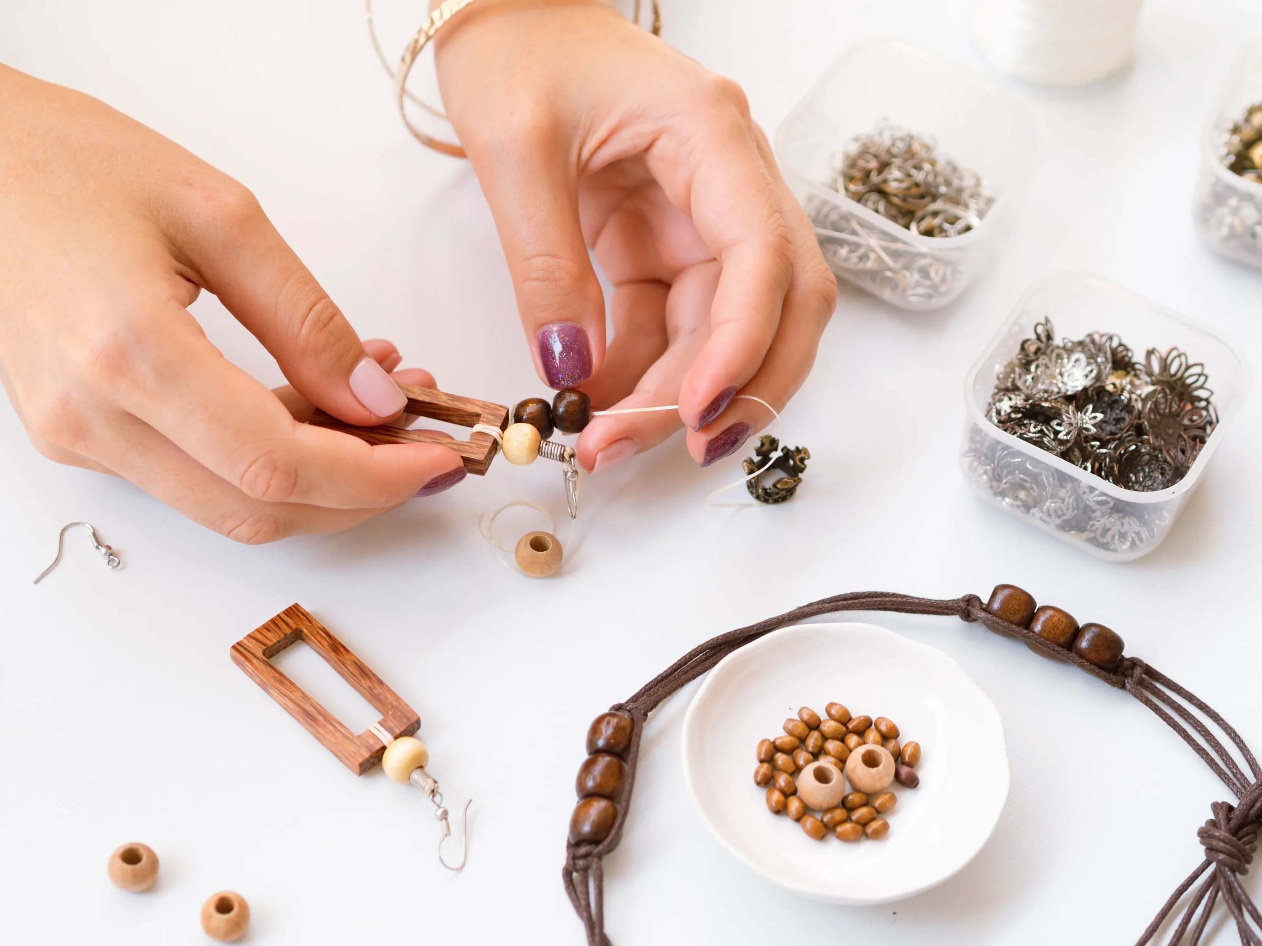 woman-making-accessories-with-wooden-beads
